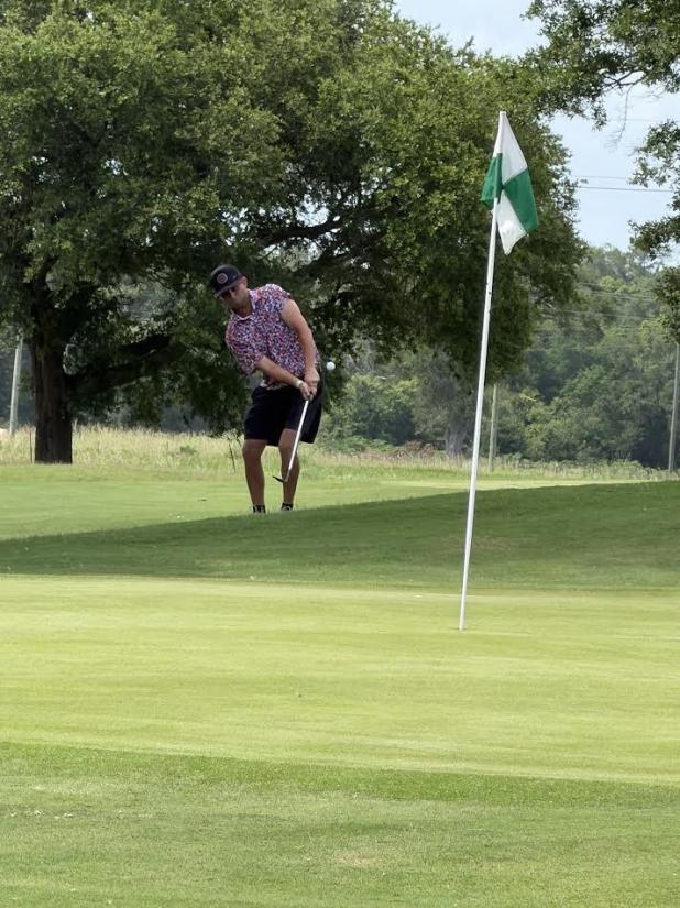 Colby Berberich was having to chip his sixth shot on the No. 18, Par 5. 
